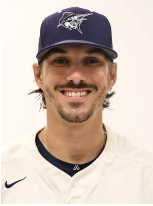 Justin Sizemore smiling in a baseball cap